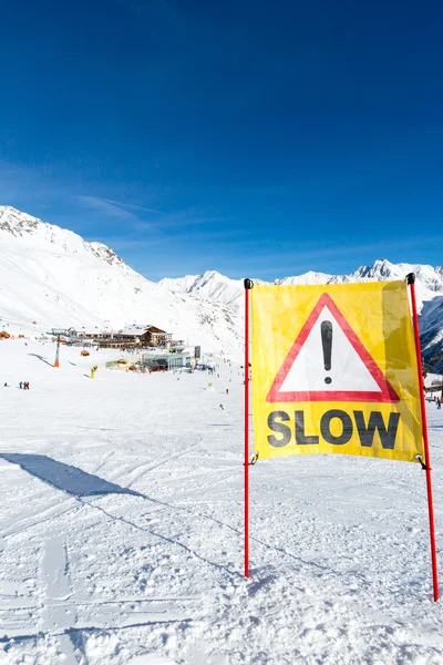 Yellow slow down warning sign