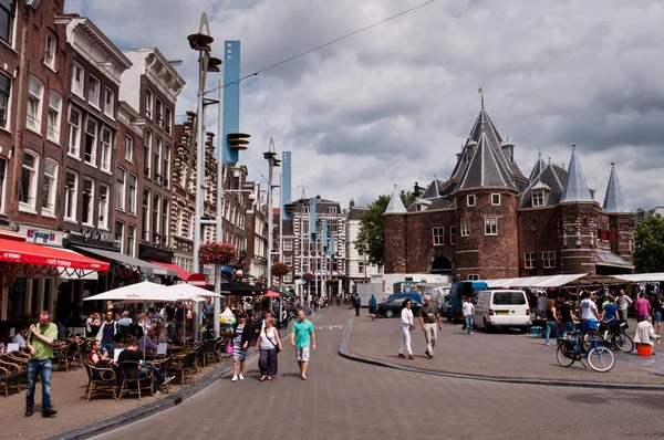 Market square (Nieuwmaart) in front of old castle like building (De Waag) in center of Amsterdam