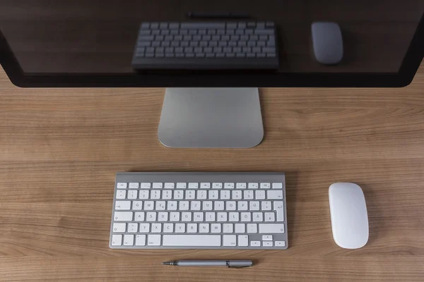 Modern computer screen with keyboard and mouse