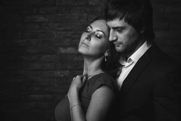 Romantic couple closed eyes enjoying spend time together. Black and white portrait.