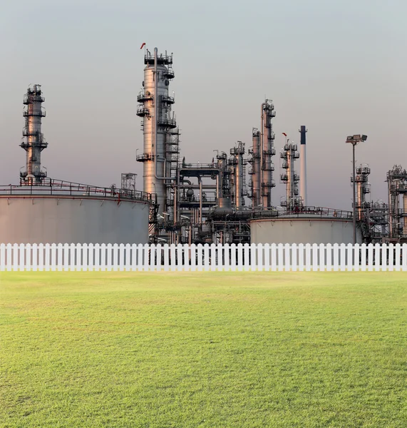 Oil refinery and green lawn.