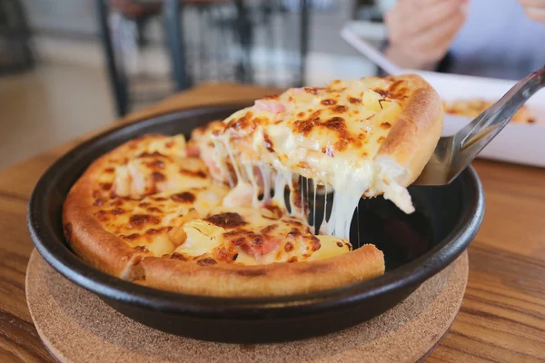 Traditional of hot cheese pizza on pan.