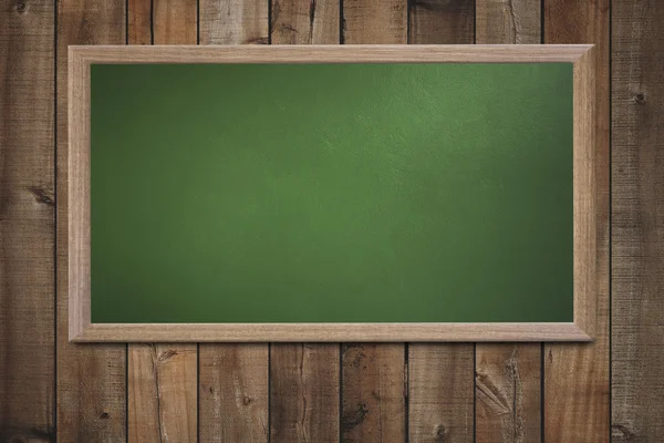 Blank old school blackboard on a grunge wall and can input text