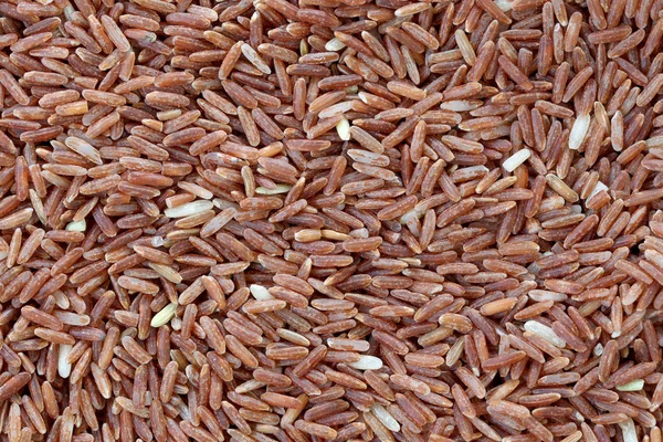 Pile of organic brown rice for the nature food background,grain