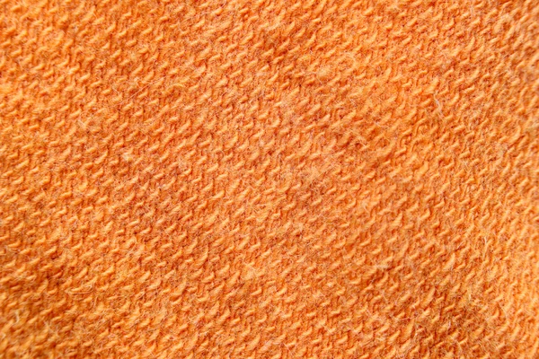 Orange patterned fabric texture.