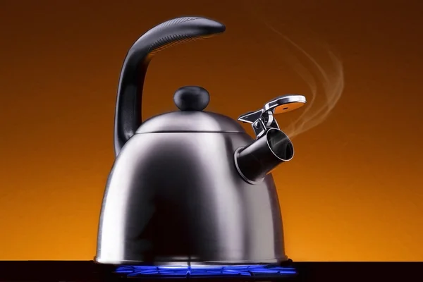 Steaming Tea Kettle on a Stove