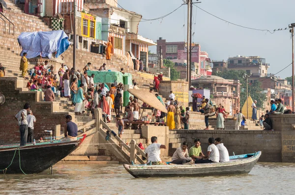 Unidentified people on the banks of the Ganges river