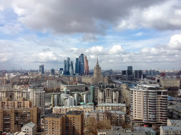 MOSCOW, RUSSIA - APR 20, 2015: New commercial district of Moscow International Business Center (Moscow-City) and old Kutuzovsky prospect with Ukraine hotel on the foreground