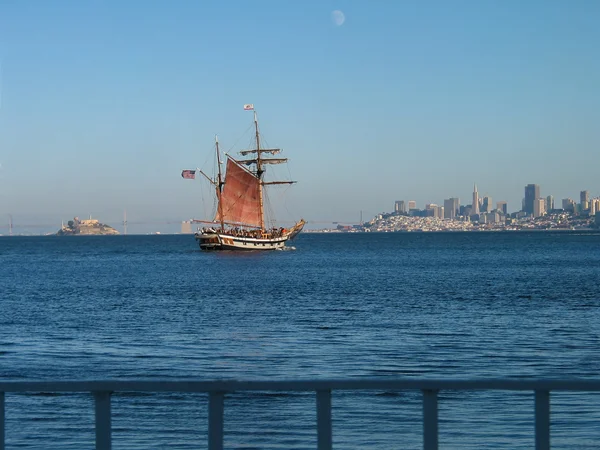 SAN FRANCISCO, CA, USA - SEPT 7, 2003: Wood sailing ship with tourists on board cruising  across the bay to the City of San Francisco on Sept 7, 2003 in San Francisco, USA