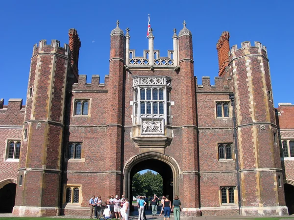 LONDON, UNITED KINGDOM - SEPT 5, 2004:  People look at Entrance to Hampton Court Palace Home of Henry VIII on Sept 5, 2004 in borough Richmond upon Thames, London, United Kingdom