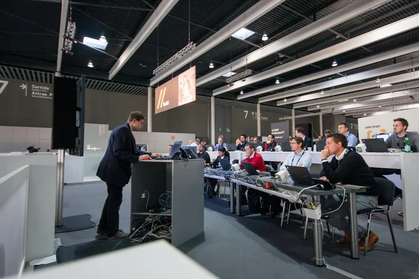 BARCELONA, SPAIN - NOVEMBER 10, 2015: People in Training zone with notebooks on tables at SAP TechEd 2015 conference at Fira Barcelona Gran Via Exhibition Center on November 10, 2014 in Barcelona, Spain