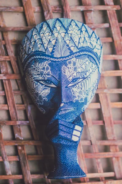 Copyrighted free image or picture of batik painted wooden mask in a blue color