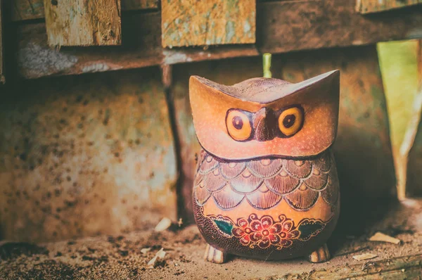 Copyrighted free image of wooden owl sculpture decorate with hand written batik ornament