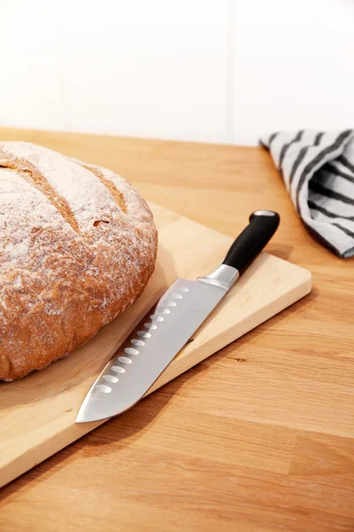 Bread and knife on a Cutting Board