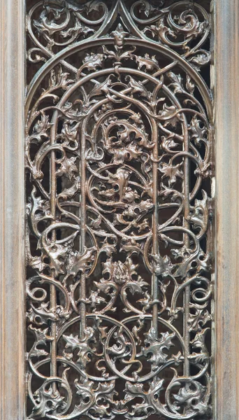 Window with decorative metal grid