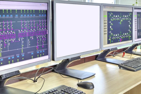 Computers and monitors with schematic diagram for supervisory, control and data acquisition