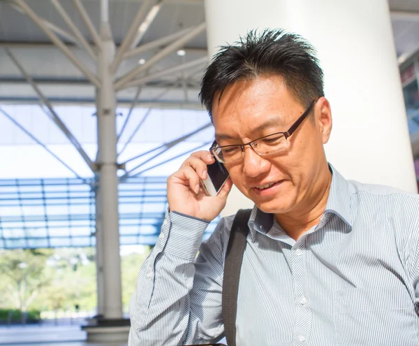 Chinese male adult on the phone