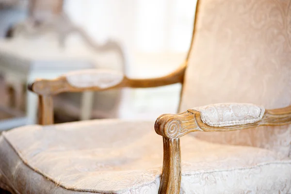 Vintage arm chair. Shabby style in a bedroom