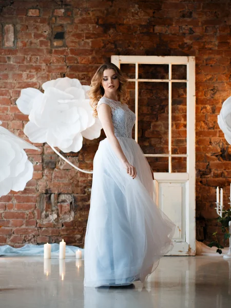 Bride in a tender light blue wedding dress in a morning over fantastic creative decoration. Fashion beauty portrait