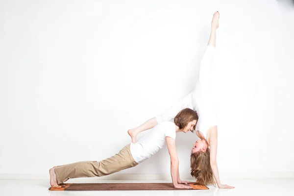 Young couple in yoga pose