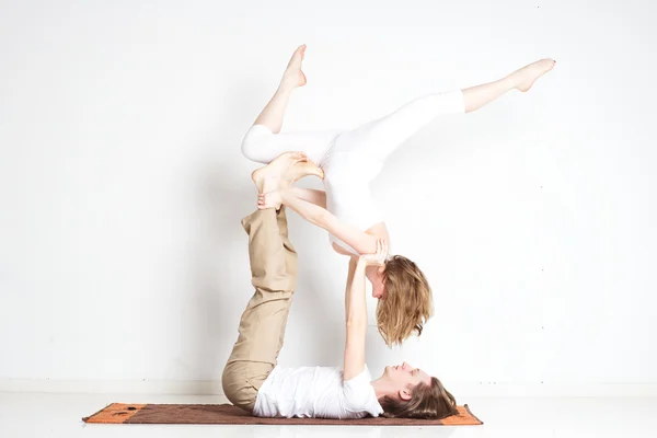 Young couple in yoga pose