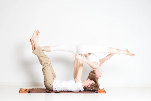 Young couple in yoga pose