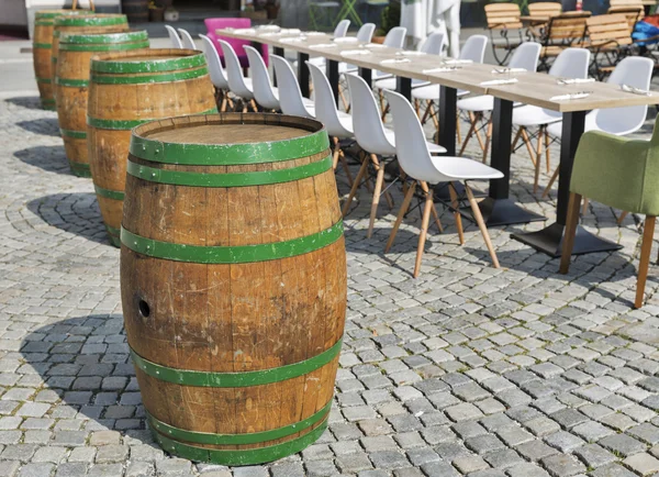 Long table and chairs are arranged in outdoor for dinner