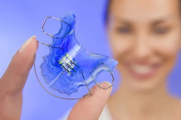 Beautiful Smiling Girl with Retainer for Teeth, Close-up