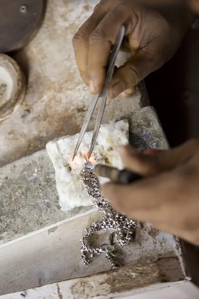 VARANASI, INDIA - MAY: Jeweler Making Jewelry. Handwork. May 15,