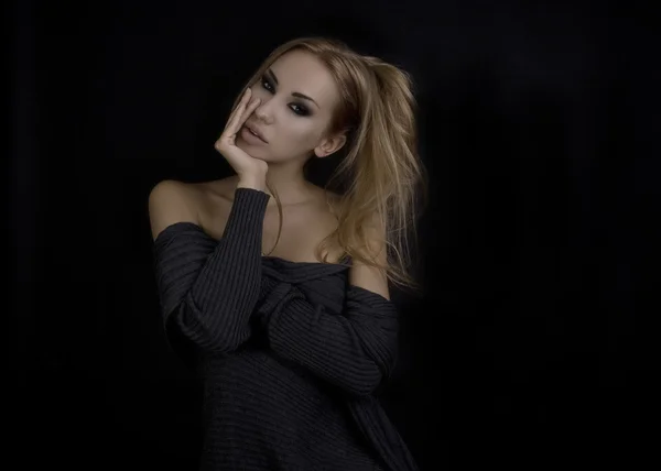 Beautiful Sexy Blond Woman. Dark Background. Smokey Eyes Makeup
