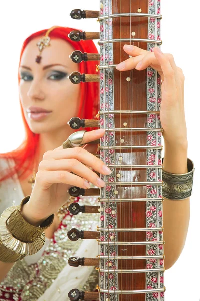 Beautiful Redhead Woman in Indian Sari with Oriental Jewelry Pla