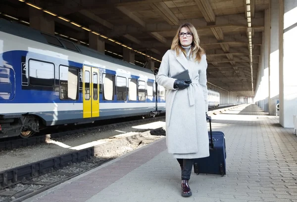 Woman walking on train station