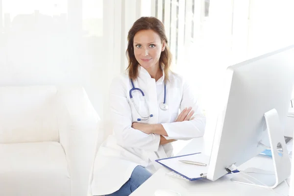 Doctor sitting at private clinic