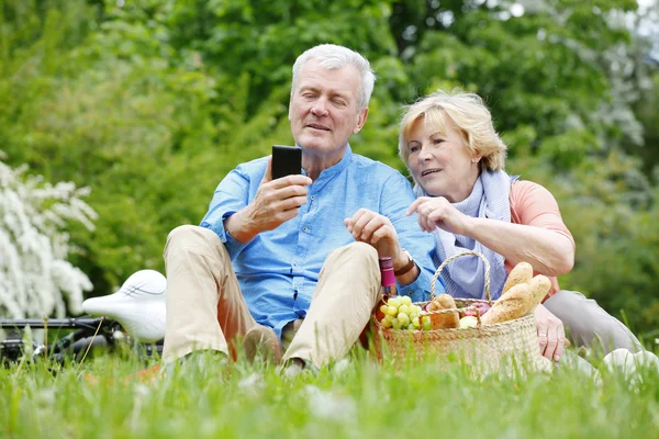 Couple mobile phone while relaxing