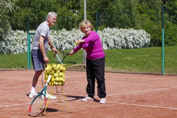 Tennis coach traning woman