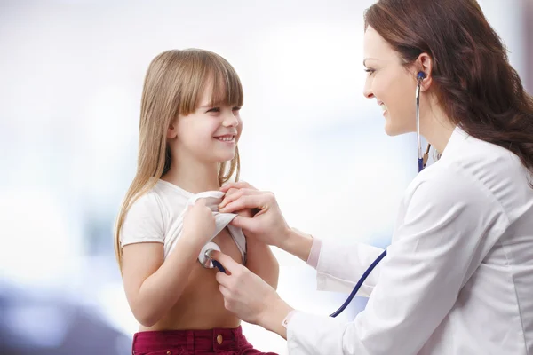 Doctor listening heart break of child