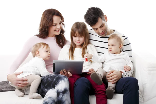 Young family using digital tablet