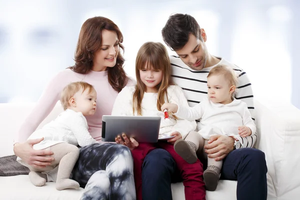 Young family using digital tablet