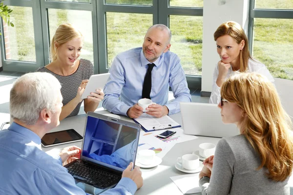 Business people sitting at office