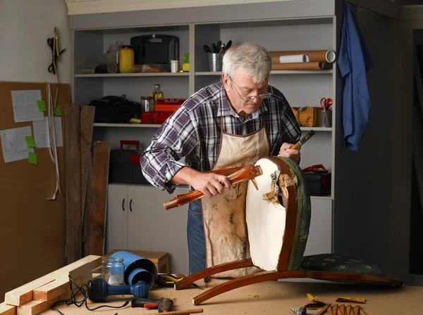 Carpenter sitting at his workshop
