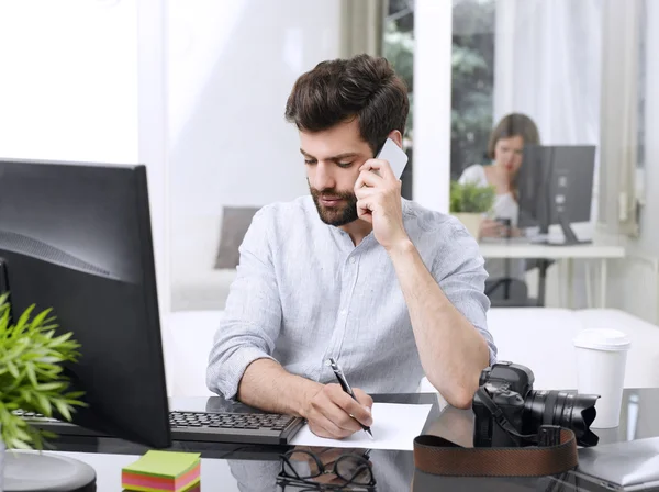 Financial assistant sitting at office