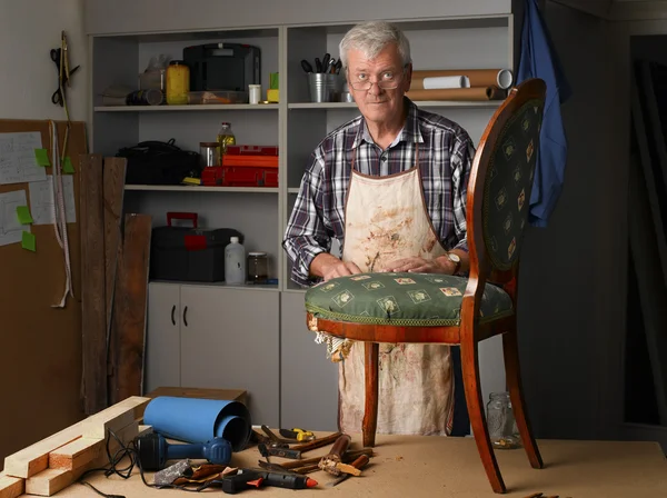 Retired man working at his workshop