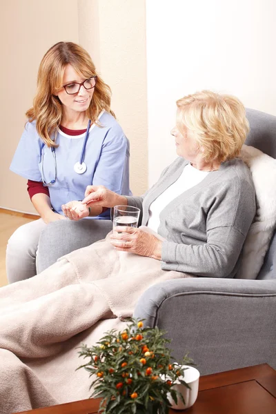 Senior woman sitting at home