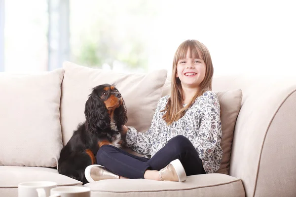 Girl sitting with her pet