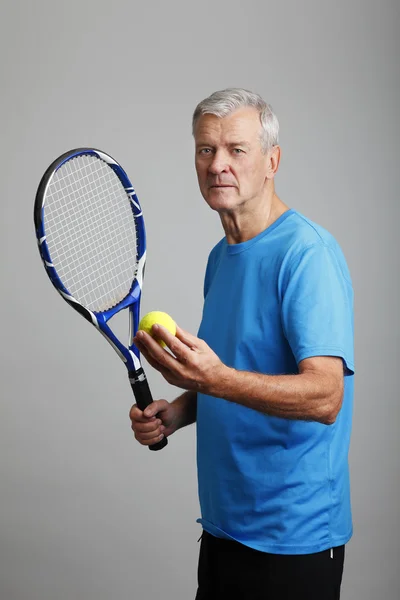 Coach holding  tennis racket