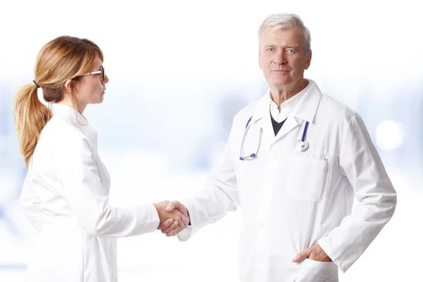 Doctor shaking hands with  surgeon