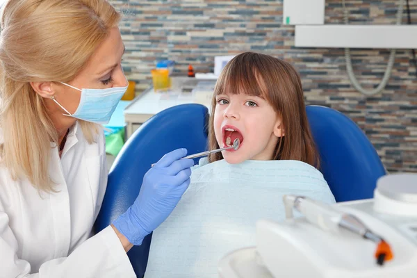 Girl has a dental examination