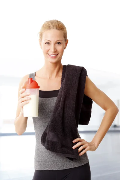 Woman holding a protein shaker