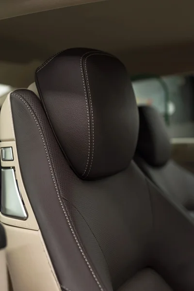 Car leather headrest. Interior detail.