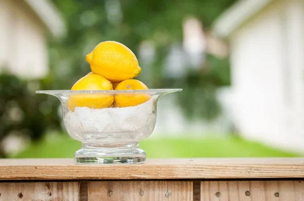 Lemons in a glass bowl at a lemonade stand